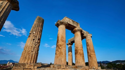 Archaic Temple of Apollo, Doric columns, Historical temple columns with a background of mountain