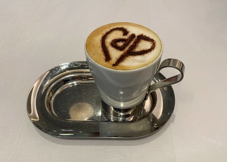 Cappuccino with Café de Paris logo made from cocoa on milk foam, Café de Paris, Dubai Mall,