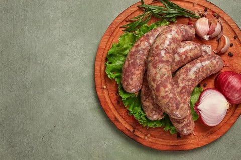 Raw kupaty, traditional Georgian sausages, raw sausages, with spices and herbs, Georgian cuisine