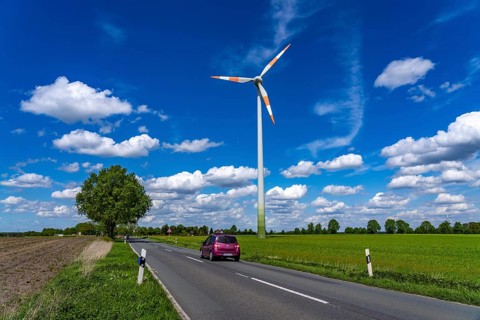 Wind turbine, wind energy plant from the manufacturer Enercon, blue sky with many white clouds,