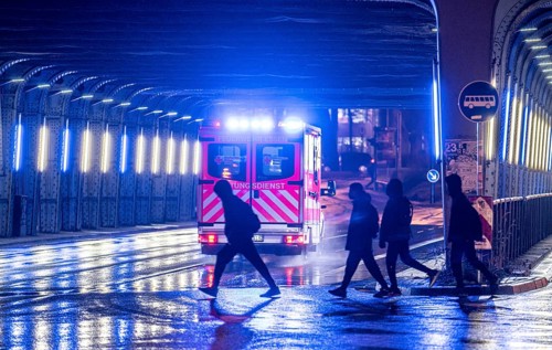 Ambulance on alarm, DRK, Essen fire brigade, rainy weather, city centre, evening, Essen, North