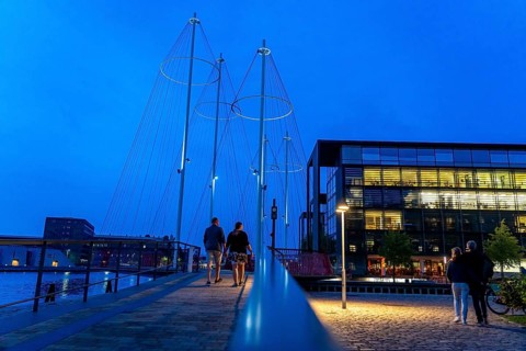 Cyclists on the Cirkelbroen cycle and pedestrian bridge, over the harbour, in the Christianshavens