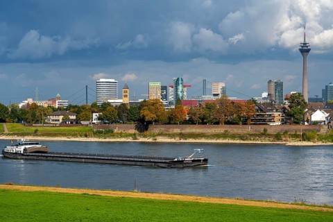 The skyline of Düsseldorf, with the skyscrapers in the Media Harbour, Rhine bridges, Rhine Tower,