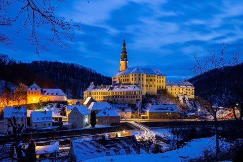 Winter evening in the Müglitz valley, impressively illuminated Weesenstein Castle at the blue hour,