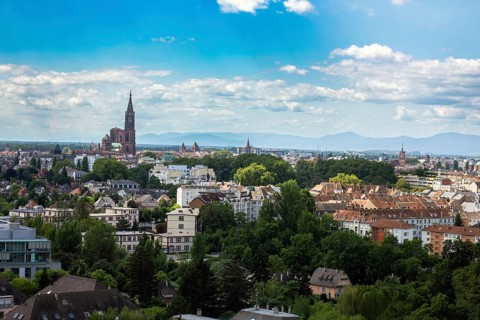 Panorama of Strasbourg with the famous cathedral and the Vosges mountains in the background