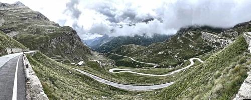 Panorama photo with HDR effect of winding pass road to Alpine pass Colle del Col de Nivolet, low