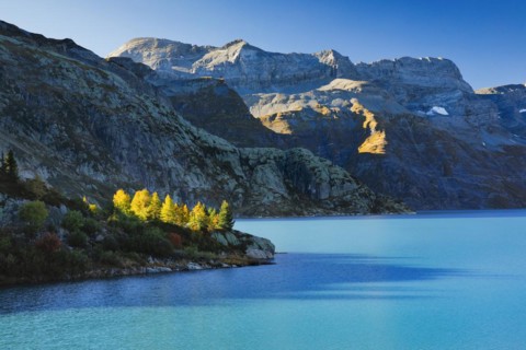 Autumn colours at Lac d'Emosson in the Valais mountains with Pic de Tenneverge in the background,