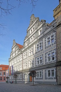 Renaissance building with sgraffiti and flags, EU flag, German state flag, Bavarian state flag,