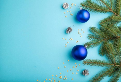 Christmas or New Year composition. Decorations, blue balls, cones, fir and spruce branches, on a