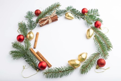 Christmas or New Year wreath composition. Decorations, balls, fir and spruce branches, on white