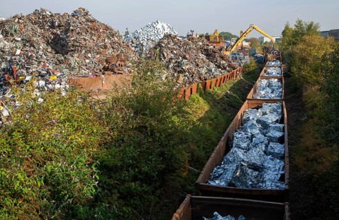 Scrap metal recycling loading train wagons with processed metals, EMR company, Swindon, England, UK