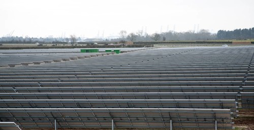 Solar array of photovoltaic panels in a large new solar park at Bucklesham, Suffolk, England,
