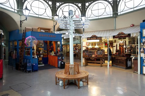 Mile marker of distances to destinations inside Guildhall market, Bath, Somerset, England, UK
