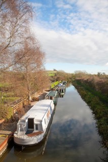 Narrowboats moored on the Kennet and Avon canal at Honey Street, Vale of Pewsey, Wiltshire,