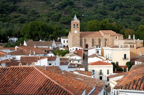 Church and houses in village of Almonaster La Real, Sierra de Aracena, Huelva province, Spain,