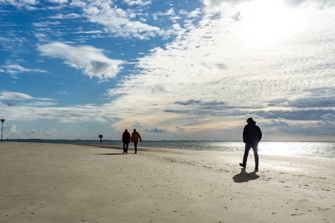 North Sea, Spiekeroog Island, autumn, strong wind drives the sand over the mudflats at low tide,