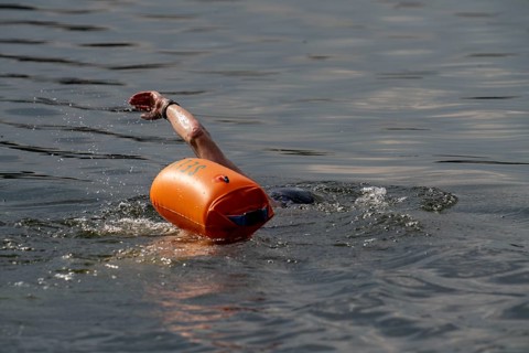 Open water swimmer, with marker buoy, in a lake, Wambachsee, 6-Seen-Platte, Duisburg, North