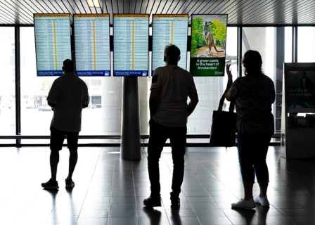 Info screens for departures, arrivals at Amsterdam Schiphol Airport, Terminal, Netherlands