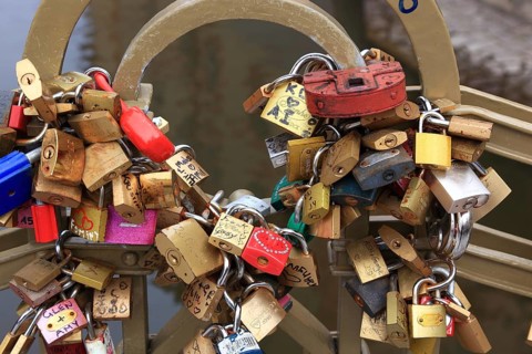 Lover's lock on a railing, love lock is a padlock which, according to custom, is attached to