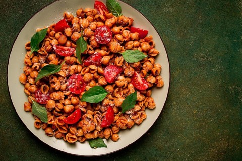 Tuscan pasta with smoked paprika and basil, parmesan cheese, Italian traditional cuisine