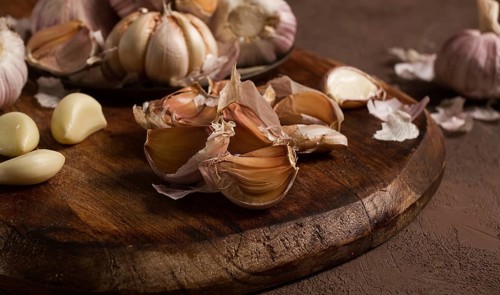 Fresh garlic, on a dark background, top view, food concept
