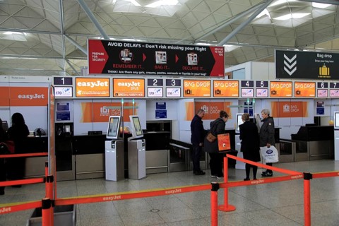 EasyJet check-in bag drop area, Stansted airport, Essex, England, UK