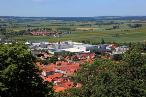 View from the castle to the company Franconian Rohrwerke Gebr. Kirchner GmbH & Co. KG and the town