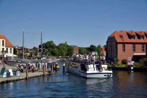 Europe, Germany, Mecklenburg-Western Pomerania, island town of Malchow, Lake Malchow, at the swing