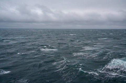 A stormy and turbulent sea under a cloudy grey sky, North Sea, Norway, Europe