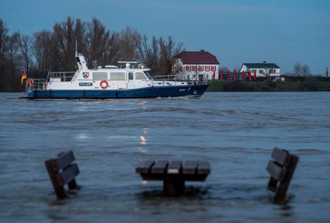 High water on the Rhine, Lower Rhine, here near Xanten, at Bislicher Insel, patrol boat of the