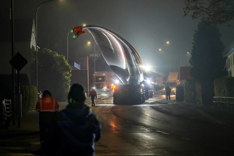 Transport of a 68 metre long, 22 tonne blade of a wind turbine, here in Breckerfeld, with a