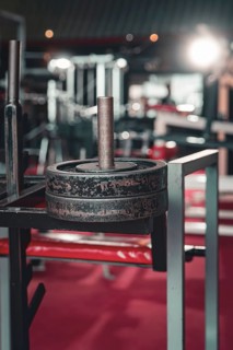 Close-up of a heavy weight on a weight bench in a modern fitness studio, Historic Fitness Studio,