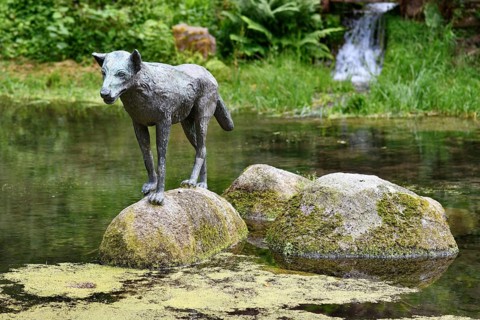 Heidelberg, Germany, June 8th 2024: Wolf sculpture at historic well called 'Wolfsbrunnen' in