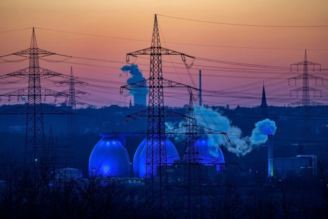 Digesters of the Emscher sewage treatment plant Bottrop, illuminated, high-voltage pylons, North