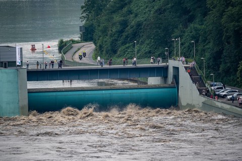 Weir of the Lake Baldeney in Essen, the masses of water roar through the open weirs, high water on