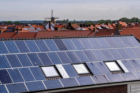 Solar modules on roofs, on the roof of a building on the dyke, North Sea coast, in Zeeland,