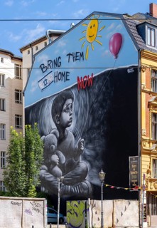 Artistically painted house facade with political background, Oranienburger Straße, Berlin, Germany,