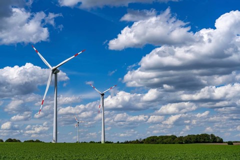 Wind farm, wind turbine, wind turbines from the manufacturer Enercon, blue sky with many white