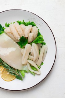 Fresh squid, raw, carcass, cut into rings, top view, no people