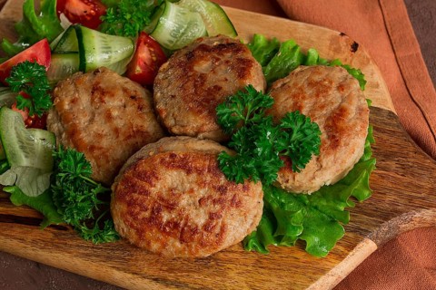 Fried cutlets, turkey, with vegetable salad, top view, no people