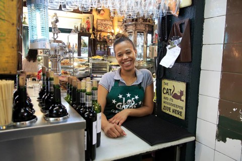 Smiling barmaid inside famous historic Los Gatos Cervecerias bar, Madrid city centre, Spain, Europe