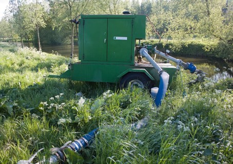 Irrigation water pump machinery on the River Stour at Bures, Essex, England, United Kingdom, Europe