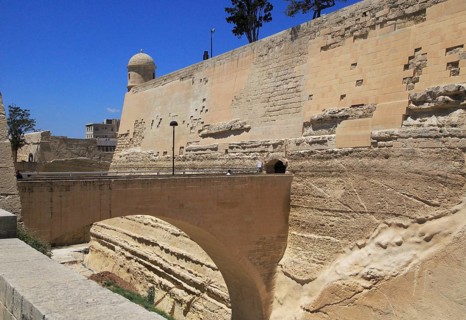 Bridge crossing moat to fortified city walls, Saint James bastion, Valletta, Malta, Europe