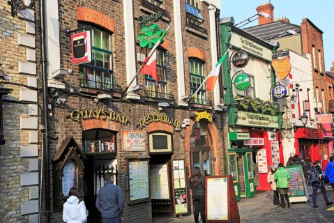 Colourful pub exteriors flags and beer signs, Temple bar area, Dublin city centre, Ireland,