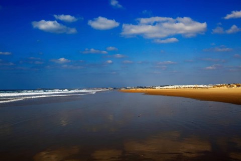 Wave breaking on sandy beach at Conil de la Frontera, Cadiz Province, Spain, Europe