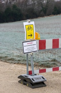Barrier due to flooding and danger of falling rocks, barrier, landslide, traffic signs, attention