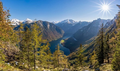 Panoramic view of the Königssee from the Archenkanzel viewpoint, autumnal forest and snow-capped