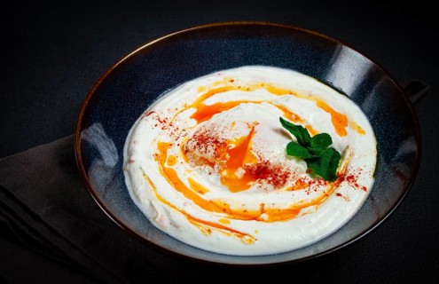 Cilbir, traditional Turkish breakfast, Turkish eggs with yogurt and butter, homemade, no people