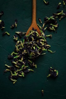 Thai, blue tea, butterfly pea tea, Anchan, wooden spoon, on a dark table, top view
