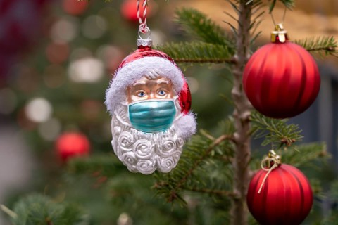 Symbolic image of Christmas in the Corona crisis, Father Christmas figure, Christmas tree